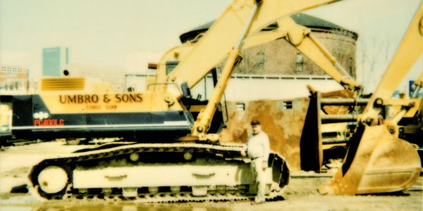 Photocopy of a man standing in front of infrastructure 