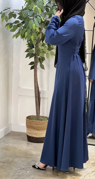 Cinched Satin Blue Dress on a model side view