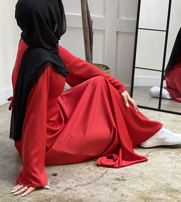 Cinched Satin Red Dress on a model seated