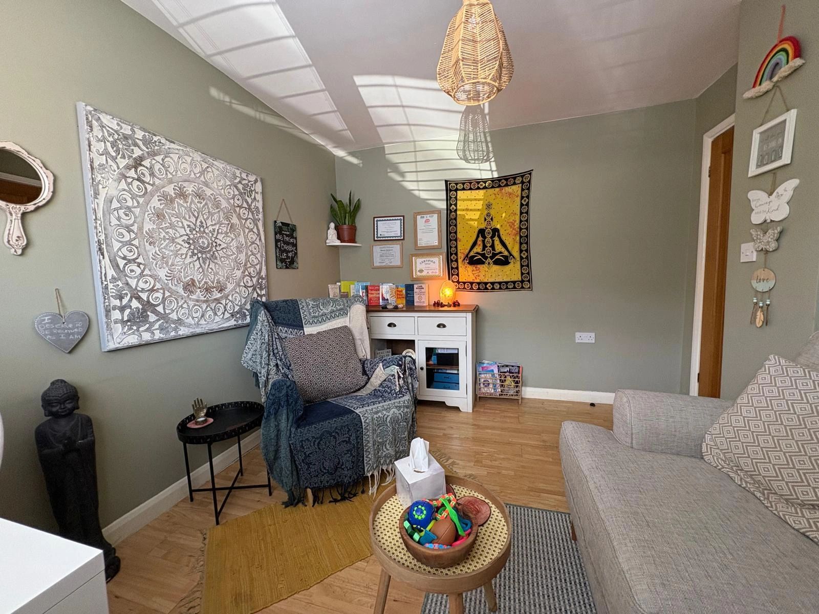 Cozy, bohemian-style living room with spiritual decor.
