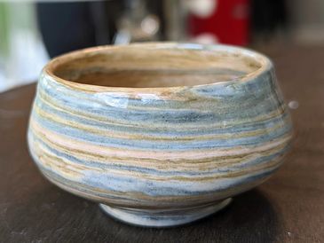 Pastel blue pink and cream tones swirled together to make a raised dipping bowl