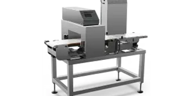 Industrial metal detector machine on a table for quality control.