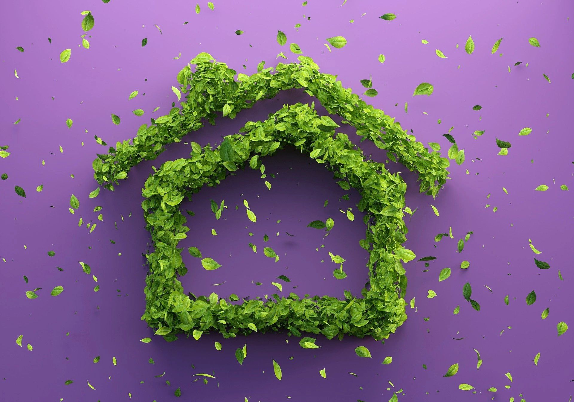 A small home structure made up of green leaves 