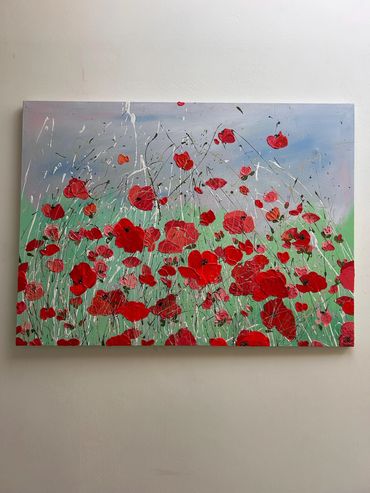 Bright red poppies across the canvas in textured, sculptural layers, creating a sense of movement