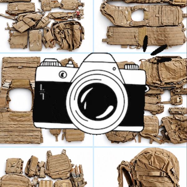 Disassembled tactical gear laid out on a surface.