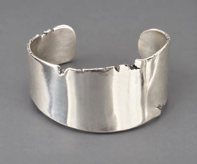 Handcrafted free-form sterling silver cuff with an organic irregular edge