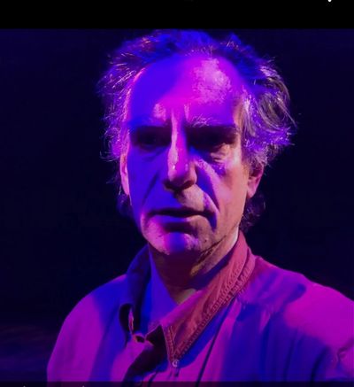 Mike Friedman under the lights at Gloucester Stage while experimenting with colored shadows.