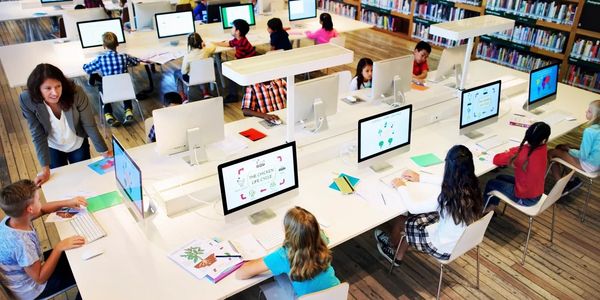 children on computers in a classroom