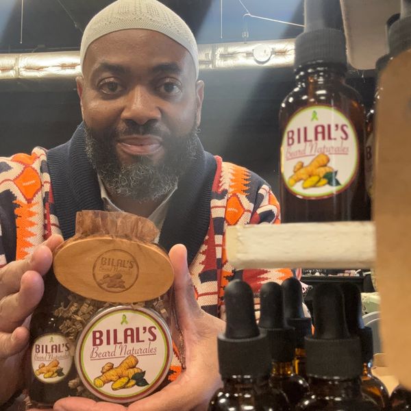 Man showcasing Bilal's Beard Naturales grooming products.