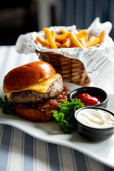 Cheeseburger with fries and dips.