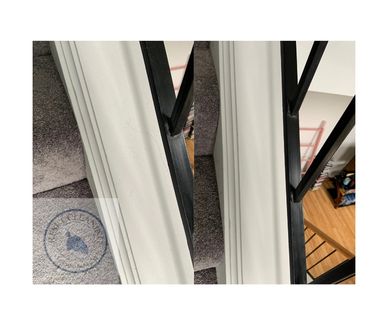 Comparison of two stair carpet edges showing different levels of wear.