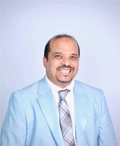 Dr. Hatem M. Gelani smiling and looking a head