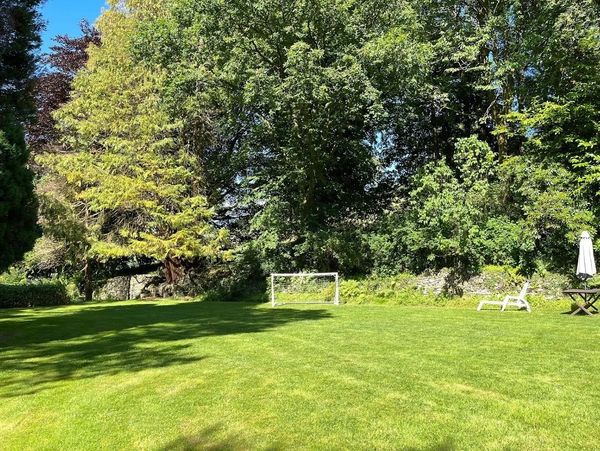 Football, tennis and badminton on the front lawn at Family Holiday Cottages mid wales