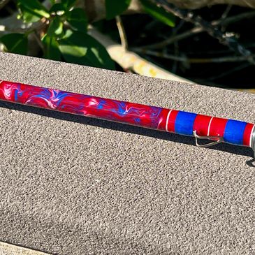 Custom saltwater rod with red, white, and blue marbling.