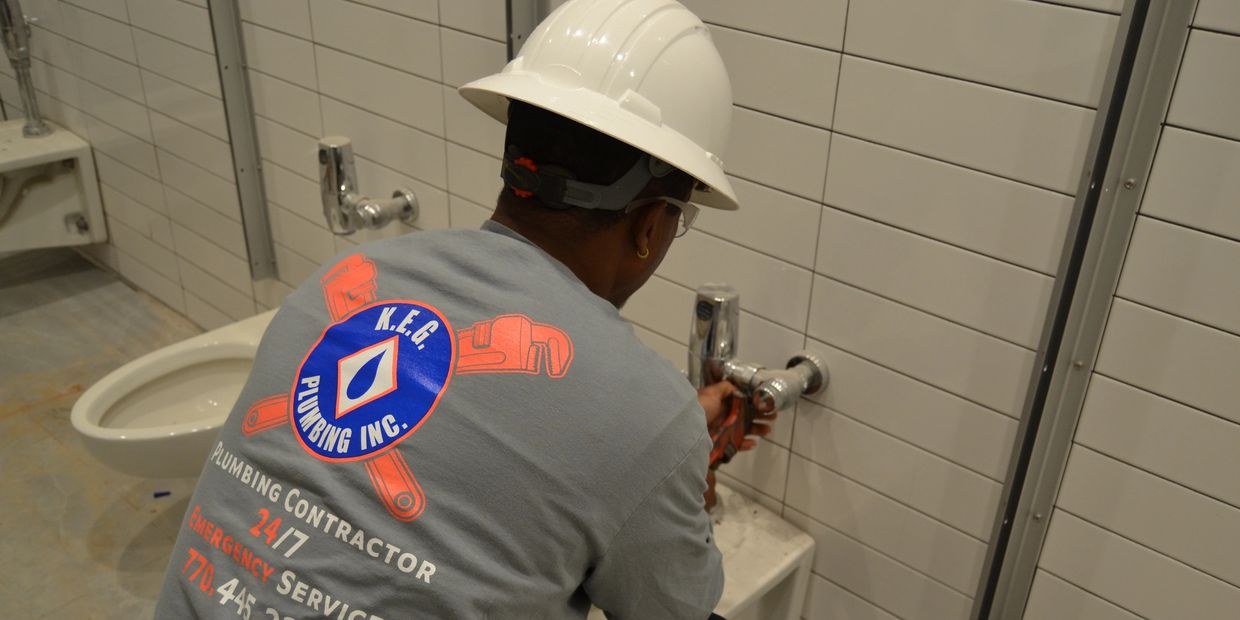 Man repairing plumbing In the bathroom