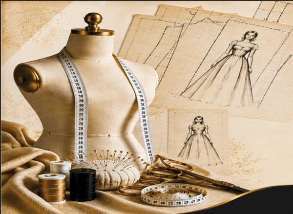 Dressmaker mannequin with sewing tools and dress sketches.
