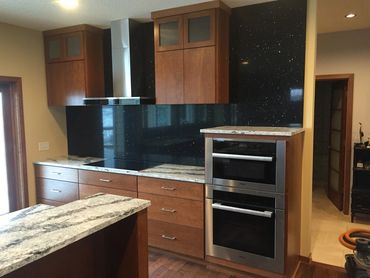 Modern Kitchen Remodel with black backsplash