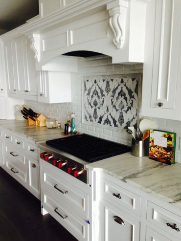 Gas cooktop with white cabinets
