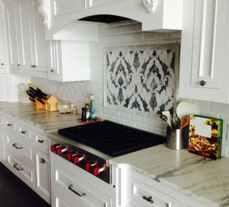 Gas cooktop in white cabinets