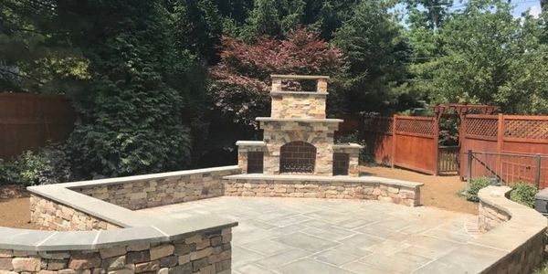 Reaction Exteriors Hardscape; stone, brick, patios, walk ways, retaining walls, & outdoor fireplaces