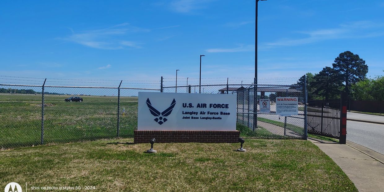 Langley Air Force Base entrance sign at Joint Base Langley-Eustis gate in Hampton VA — veteran-owned