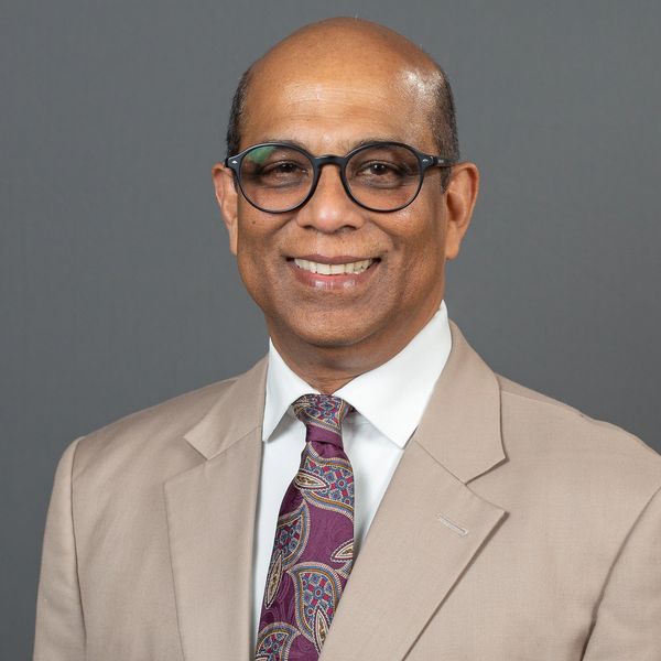 A headshot of Chris Senanayake, Ph.D.