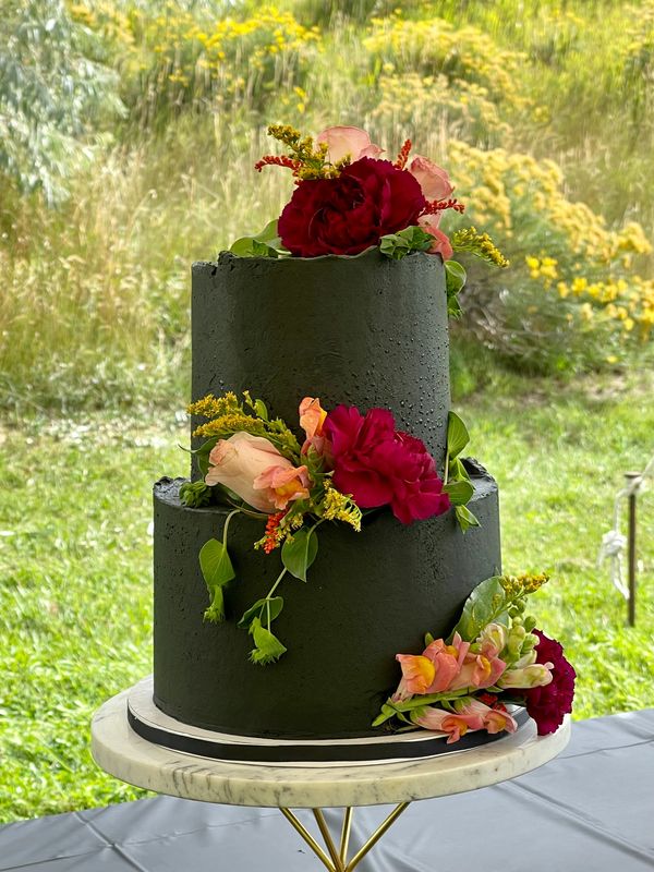 Modern Black Wedding Cake with fresh flowers