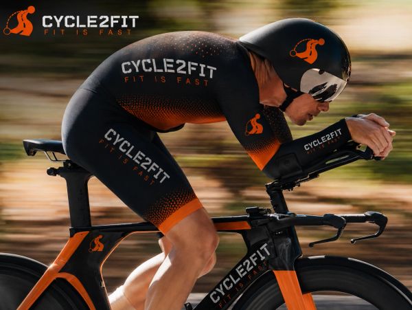 Cyclist in aerodynamic gear with Cycle2Fit branding rides a high-speed bike.