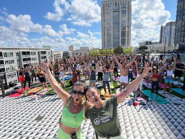 Rooftop wellness event yoga class Sunday brunch
