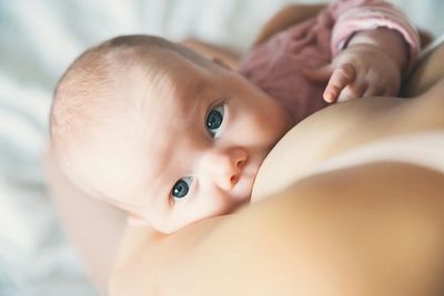 Beautiful baby breastfeeding