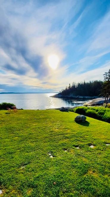 Green lawn on the oceanfront of St Margarets Bay, Nova Scotia