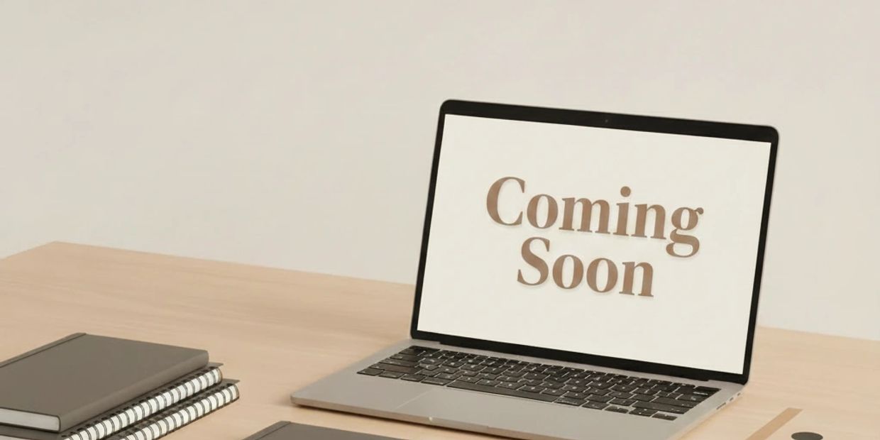 Laptop screen displaying "Coming Soon" on a desk.