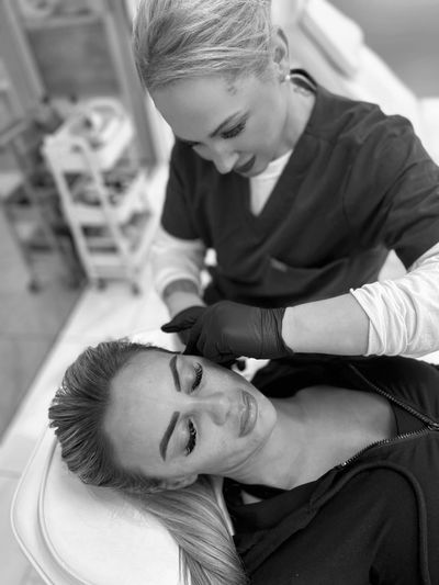 A client receiving polynucleotide treatment , with Botox and cheek dermal filler. 