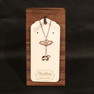 Cow abduction necklace.