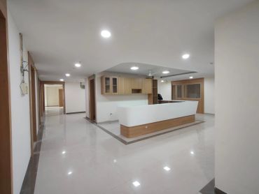 Modern, spacious office interior with reception desk.