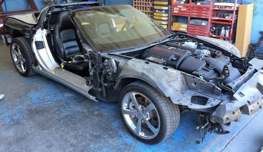 A car with removed parts for auto collision repair near Santee, CA