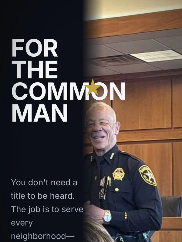 Sheriff in uniform smiling with text 'For the Common Man' beside him.