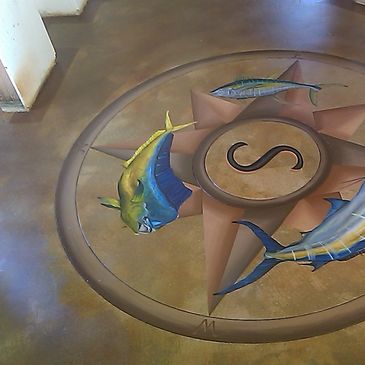 Decorative stained concrete floors with logos. Baseboards were installed & wall painting came later.