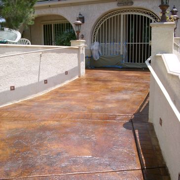 Concrete stained patio / entry in 3 colors. The concrete was prepped, stained, spray-sealed 2 times.