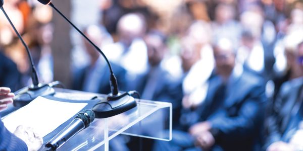 Microphone and podium ready for a speaker at a conference or seminar.