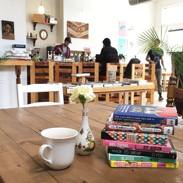 Books and tea on a table at Two Dollar Radio HQ