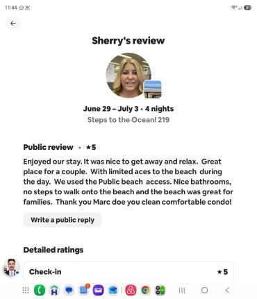 Positive 5-star review praising beach access and cleanliness.