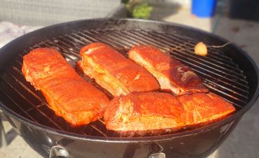 Pork Belly being smoked on the BBQ.