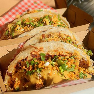 Crispy Roti bread filled with char sui pork, fresh herb salad and spring onions.