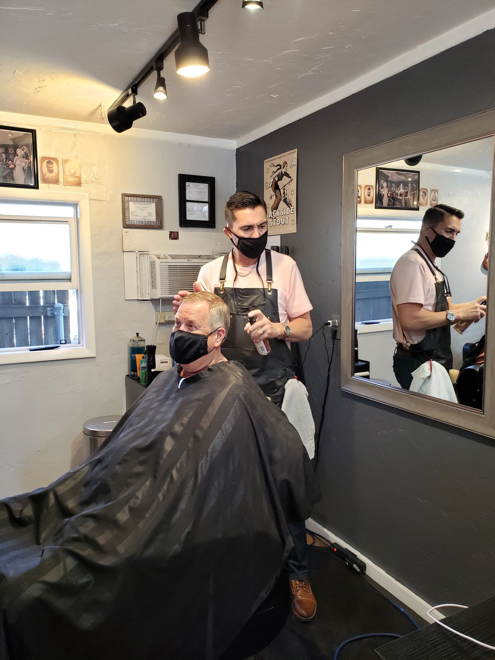 Why do Barbers always face the client away from the mirror?