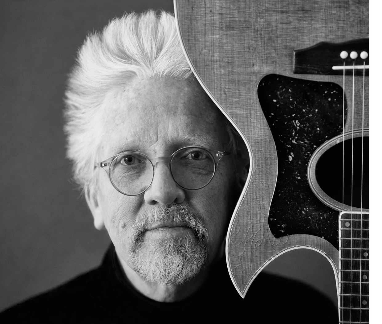 singer songwriter Dave Herlihy with his guitar