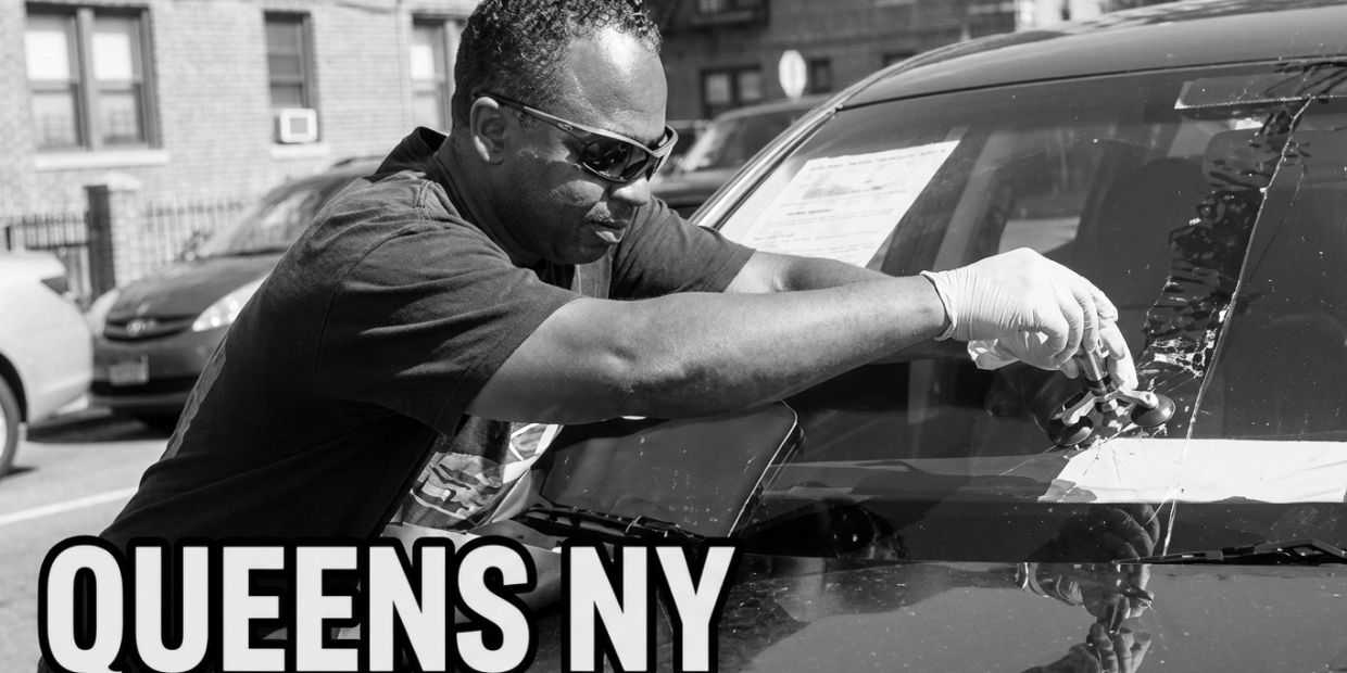 Expert windshield repair technician repairing a chip in the car windshield.