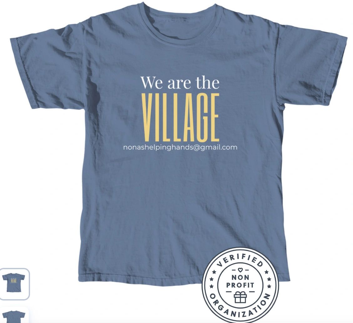 Blue T-shirt with the text 'We are the VILLAGE' and an email address.