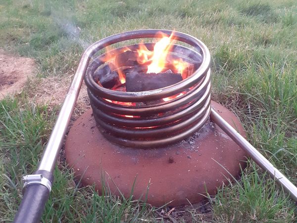A stainless steel coil with a fire in provides the heat for the Scotchtub, connected with heat resis