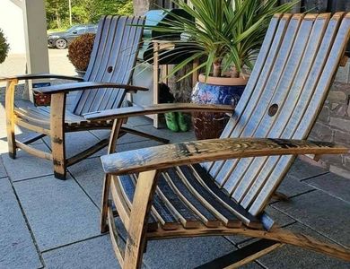 a pair of oak whisky barrel stave chairs on a terrace made by Wee Dram Barrel Creations